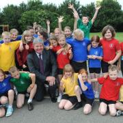 Sir Keith Mills, deputy director of the 2012 Olympics, with pupils at Heath Primary School in Kesgrave in 2008