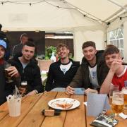 Fans gather to watch England play at the Railway Inn in Westerfield