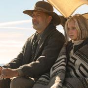 Tom Hanks plays a civil war veteran travelling from town to town in the Old West reading the news. (from left) Captain Jefferson Kyle Kidd (Tom Hanks) and Johanna Leonberger (Helena Zengel) in News of the World, co-written and directed by Paul