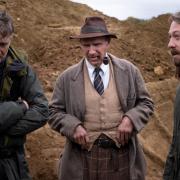 Ralph Fiennes on location shooting The Dig with director Simon Stone, right, and director or photography Mike Eley, left.