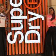 Stilt walkers welcoming excited shoppers to the new Superdry in Ipswich Picture: ARCHANT