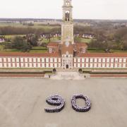 The Queen's 90th birthday was marked at the Royal Hospital School by students creating a large number 90 for an aerial photograph in front of the school.