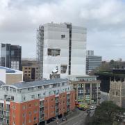 The shrink wrap covering St Francis Tower in Ipswich has come off in Storm Eunice