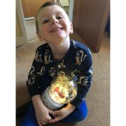 Harvey, aged four, with his Christmas snowglobe