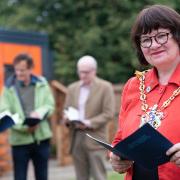 Mayor of Ipswich Elizabeth Hughes handed out books to new residents in Whitton's microhomes by the Poet Lauriate, Simon Armitage. Picture: Sarah Lucy Brown
