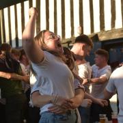 Fans at Isaacs celebrate Harry Kane's first half goal against Ukraine