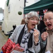 The Great Framlingham Sausage Festival. Linda Ling and David Ling tasting Suffolk Black Pigs pork sausages at the 2016 event