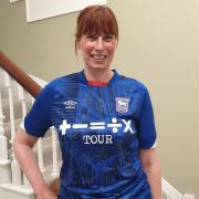 Julie Long, fundraising manager at Suffolk Mind sporting the signed Ipswich Town Football Club shirt.