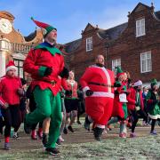 Runners dressed as elves, Santa Claus and Christmas trees gathered at Christchurch Park today for a festive-themed fun run.