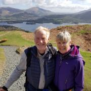 Tributes have been paid to George Thomas, who has died aged 75. Pictured here with his wife, Pauline, in the Lake District, a place he loved.