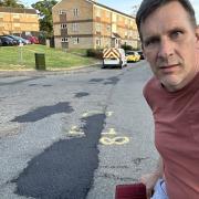 Councillor Tony Blacker has handed in a petition to Suffolk County Council to fix the roads on four streets in Ipswich