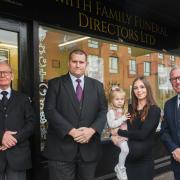 A new family-run funeral directors has opened up in Felixstowe. Pictured L-R: Alistair Parker, business owner Luke Smith and his wife Victoria, holding two-year-old Layla, and Michael Davies. Image: Charlotte Bond