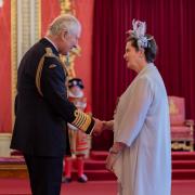 King Charles III presents an OBE award to Fiona Jane Ellis, chief executive officer of Survivors in Transition in Ipswich.