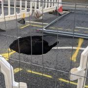 A huge sinkhole has closed Foxhall Road in Ipswich
