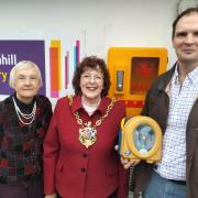 Inga Lockington, Lynne Mortimer and Dr Dan Poulter with the defibrillator at Broomhill library.