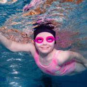 Two children have swam more than a mile to raise money for deaf children