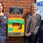 Rebecca Long, Kirsty Goldsack and Jackie Arnold-Burns with the defibrillator