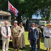 Show president Rt Rev Martin Seeley with volunteers on the Normandy 80 stand
