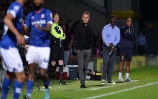 Ipswich Town manager Kieran McKenna on the touchline at Burton Albion as Brewers' boss Jimmy Floyd Hasselbaink also watches on