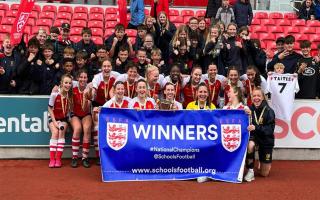 The women's U18 football team at St Joseph's College in Ipswich are celebrating after winning the treble