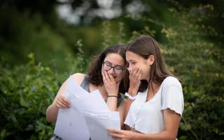 Students across Ipswich celebrated as they opened their A Level results. Isla Crossley and Isabelle Hender looking at their results.